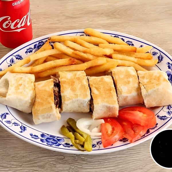 Ali Baba Kabab's shawarma wraps, fries, tomatoes, onions, and pickles on a plate with a Coke.